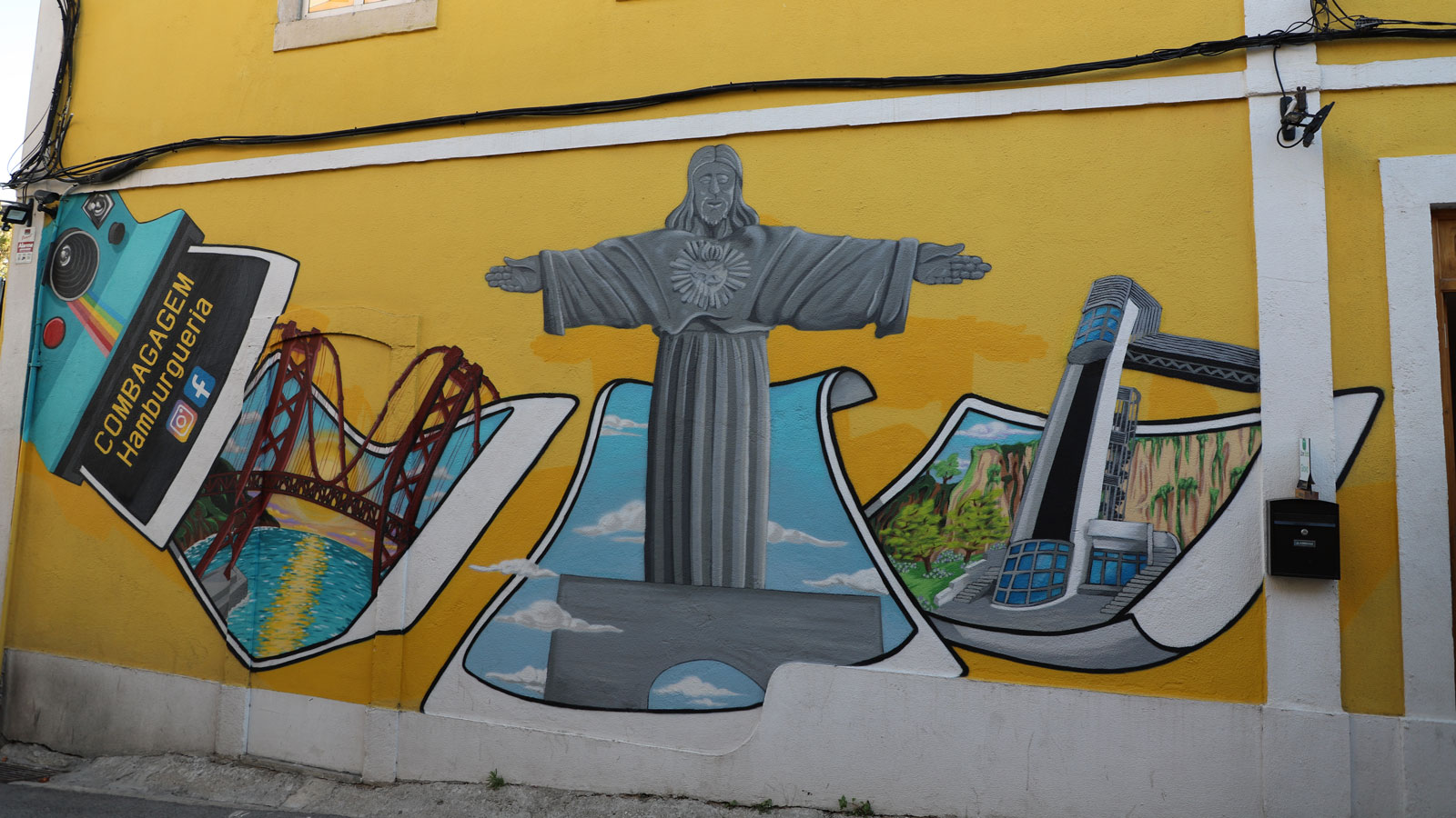 Urbane Kunst in Lissabon: Die Christus-Statue auf einer Hauswand
